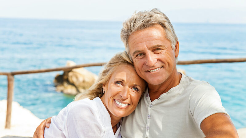 An Older Couple After Plastic Surgery Riding On A Yacht - Martin Plastic Surgery Toronto